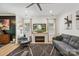 Cozy living room with fireplace, TV, and lots of natural light at 324 Elm St, Belmont, NC 28012