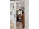 Organized walk-in closet featuring shelving and rods, with a patterned rug adding a touch of style at 324 Elm St, Belmont, NC 28012