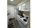 Functional kitchen featuring essential appliances and white cabinetry offering convenience for daily cooking at 415 Orchard Trace Ln # 1, Charlotte, NC 28213