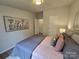 Comfortable bedroom featuring stylish decor, a plush bed, and ample natural light at 5010 Hemphill Rd, Gastonia, NC 28056