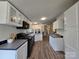 Modern kitchen featuring sleek countertops, black appliances, and ample cabinet space at 5010 Hemphill Rd, Gastonia, NC 28056