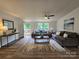 Spacious living room featuring stylish furniture, natural light, and a cozy atmosphere at 5010 Hemphill Rd, Gastonia, NC 28056