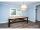 Sunlit dining room featuring stylish flooring, walls, and a modern light fixture at 5100 Crestland Ave, Charlotte, NC 28269