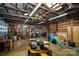 Spacious garage interior with high ceilings, wooden beams and skate ramp at 5100 Crestland Ave, Charlotte, NC 28269