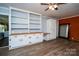 Spacious living room with built in shelving and cabinets at 5100 Crestland Ave, Charlotte, NC 28269
