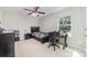 A bedroom with a ceiling fan, desk, bed and a view from the window at 532 Dalkeith Ave, Rock Hill, SC 29732