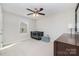 Neutral bedroom with a ceiling fan, black baby bed and dark furniture at 532 Dalkeith Ave, Rock Hill, SC 29732