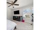 Neutral bedroom with a ceiling fan, TV, black shelving and a view from the window at 532 Dalkeith Ave, Rock Hill, SC 29732