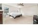 Neutral bedroom with a ceiling fan, large bed and two large windows at 532 Dalkeith Ave, Rock Hill, SC 29732