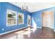 Bright dining room with hardwood floors, large windows, and a chandelier provides an elegant space for meals at 532 Dalkeith Ave, Rock Hill, SC 29732
