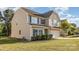 Attractive tan two-story home featuring blue shutters, a well-kept lawn, and a two-car garage at 532 Dalkeith Ave, Rock Hill, SC 29732