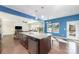 Open-concept kitchen features a large island with granite countertops, a stainless steel dishwasher, and a sink at 532 Dalkeith Ave, Rock Hill, SC 29732