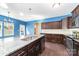 A spacious kitchen boasts dark wood cabinets, stainless appliances, granite countertops, and a large island at 532 Dalkeith Ave, Rock Hill, SC 29732