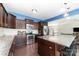 Well-lit kitchen features stainless steel appliances, dark wood cabinetry, and a large island with granite countertops at 532 Dalkeith Ave, Rock Hill, SC 29732