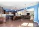 A wide view of kitchen and living space features dark wood cabinets and flooring, and stainless steel appliances at 532 Dalkeith Ave, Rock Hill, SC 29732