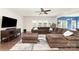 Inviting living room featuring a plush sectional sofa, tv, and lots of natural light at 532 Dalkeith Ave, Rock Hill, SC 29732