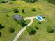 Aerial view of property showcasing the house, pool, surrounding land, mature trees, and long driveway at 5873 Alexis Ln, Vale, NC 28168