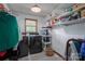 Functional laundry room with shelving, modern machines and natural light at 5873 Alexis Ln, Vale, NC 28168