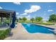 In-ground swimming pool surrounded by lounge chairs and open yard space at 5873 Alexis Ln, Vale, NC 28168