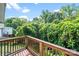 View of a wooded backyard from a wood deck at 668 Smith St, Kannapolis, NC 28083