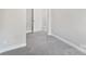 Cozy bedroom with neutral walls, carpeted floors, and white trim and doors at 668 Smith St, Kannapolis, NC 28083