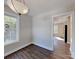 Bright and airy dining room with wood-style flooring, chandelier, and natural light at 668 Smith St, Kannapolis, NC 28083