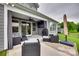 Covered patio area with modern outdoor seating and view of backyard at 7049 Irongate Dr, Indian Land, SC 29707