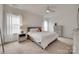 Cozy bedroom with a comfortable bed, soft lighting, and serene neutral tones at 7049 Irongate Dr, Indian Land, SC 29707