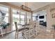 A dining area features large sliding doors to a covered patio and an adjacent living room at 7049 Irongate Dr, Indian Land, SC 29707
