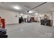 Spacious garage with overhead lighting and plenty of room for storage and organization at 7049 Irongate Dr, Indian Land, SC 29707
