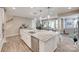 A modern kitchen features a granite island, stainless steel appliances, and an open floor plan at 7049 Irongate Dr, Indian Land, SC 29707