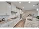 Bright and airy kitchen featuring gas cooktop, granite countertops and stainless steel appliances at 7049 Irongate Dr, Indian Land, SC 29707