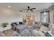 This open living room has plush seating and easy access to the kitchen and dining areas at 7049 Irongate Dr, Indian Land, SC 29707