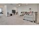 Open living room with cozy sofas, a TV console, and ample space for relaxing at 7049 Irongate Dr, Indian Land, SC 29707