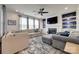 A comfortable living room with a fireplace, a ceiling fan and plenty of natural light at 7049 Irongate Dr, Indian Land, SC 29707