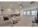 Bright living room featuring neutral decor, plush seating, and natural light from large windows at 7049 Irongate Dr, Indian Land, SC 29707