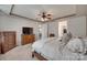 Spacious main bedroom with trey ceiling, ceiling fan, and matching furniture at 7049 Irongate Dr, Indian Land, SC 29707