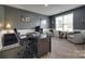 Home office features wood floors, neutral paint, a large window and ample seating at 7049 Irongate Dr, Indian Land, SC 29707