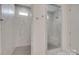 Gorgeous shower room features marble walls and floor, glass shower doors and bench seating at 7049 Irongate Dr, Indian Land, SC 29707
