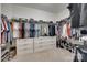 Custom walk-in closet with ample storage, shelving, and hanging space for organization at 7049 Irongate Dr, Indian Land, SC 29707