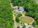 The aerial view shows a community park with a modern playground and walking paths at 83 Woodsdale Se Pl, Concord, NC 28025