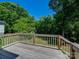 Relax on the back deck with wooded scenery in this charming home with a natural light exposure at 83 Woodsdale Se Pl, Concord, NC 28025