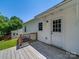 The back of the house has a wood porch, white siding and a nice view at 83 Woodsdale Se Pl, Concord, NC 28025