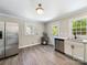 Spacious kitchen equipped with stainless steel appliances, white cabinets, and updated fixtures at 83 Woodsdale Se Pl, Concord, NC 28025