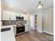 This kitchen offers stainless appliances, bright countertops, and modern cabinetry at 83 Woodsdale Se Pl, Concord, NC 28025