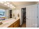 Bathroom features a double sink vanity and open closet spaces at 8520 Wright Rd, Kannapolis, NC 28081
