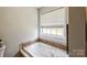 Bathroom features a tiled jacuzzi style tub at 8520 Wright Rd, Kannapolis, NC 28081