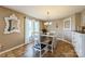 Elegant dining room featuring a stylish table set, decorative mirror, and ample natural light at 8520 Wright Rd, Kannapolis, NC 28081