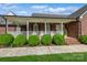 Inviting front porch with white railings and classic brick facade at 8520 Wright Rd, Kannapolis, NC 28081