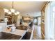 Open concept kitchen and dining area perfect for gatherings, featuring neutral tones and lots of natural light at 8520 Wright Rd, Kannapolis, NC 28081